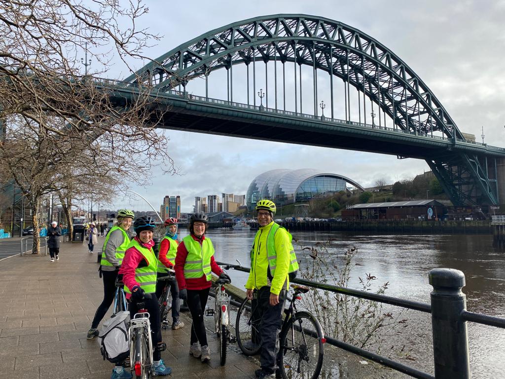 Newcastle bridge with cyclists supporting the new clean air zone.